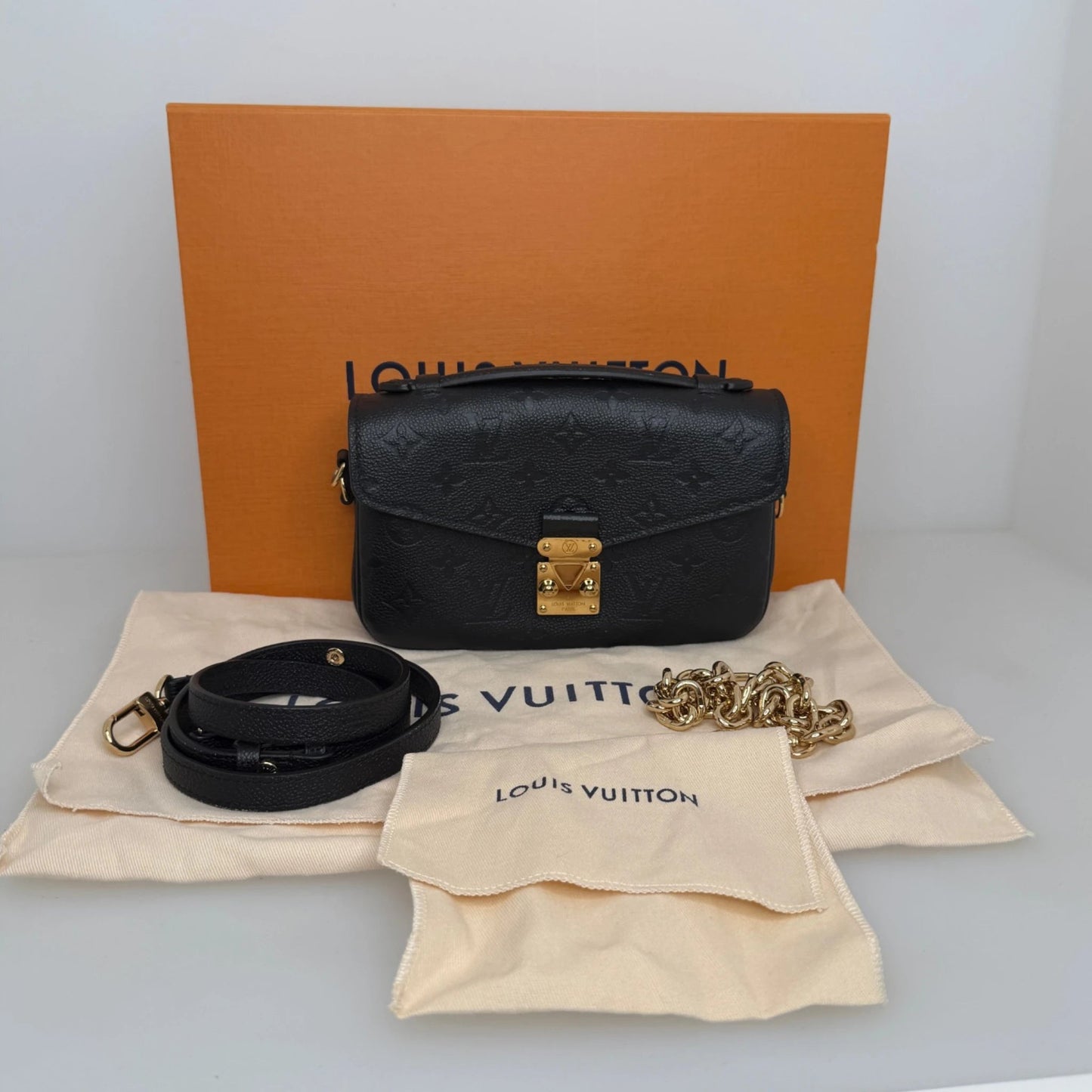 Louis Vuitton Pochette Métis East West Empreinte Leder schwarz / sehr gut Louis Vuitton