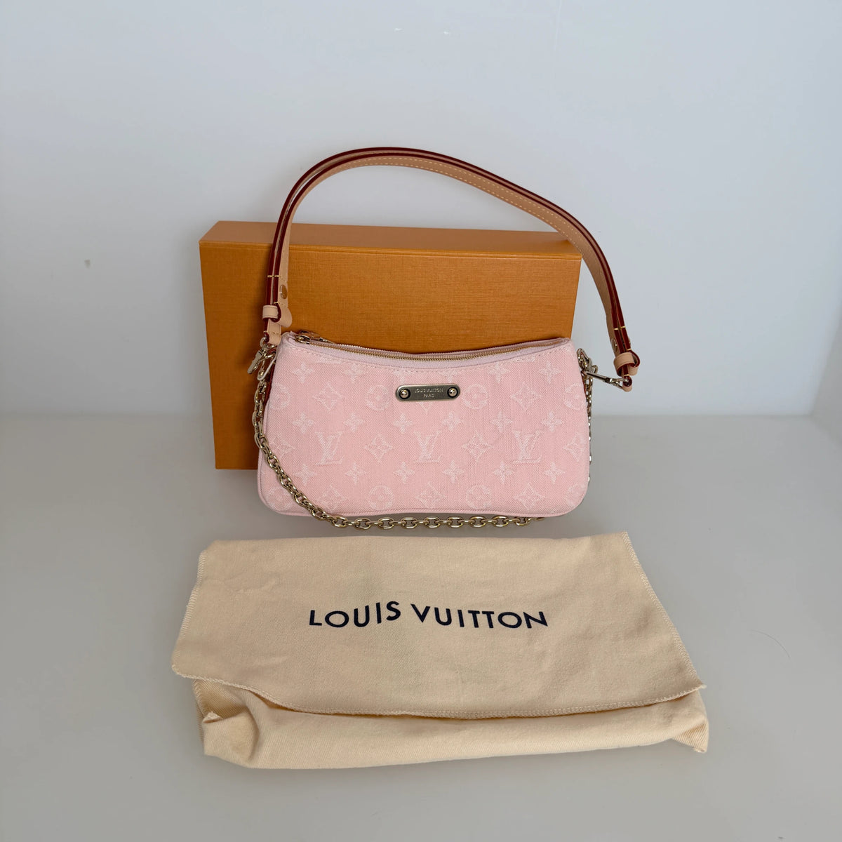 Louis Vuitton Pochette Liv Monogram Denim Washed Pink Gold